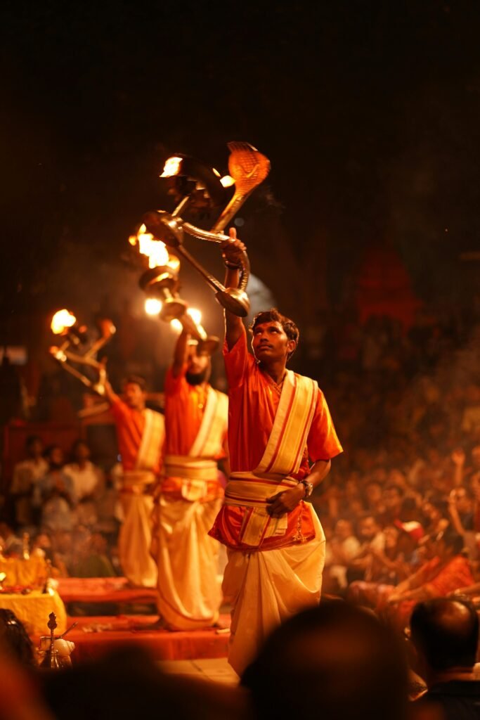 pexels-photo-28819289-28819289 Priests perform the sacred Ganga Aarti ritual on the ghats of Varanasi, India.